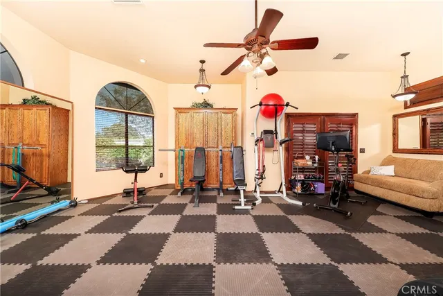 a view of swimming pool with outdoor seating and plants
