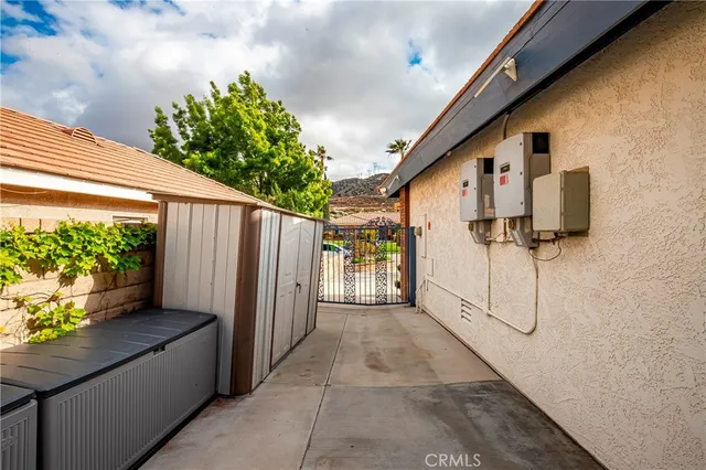 a living room with furniture a chandelier and a fireplace