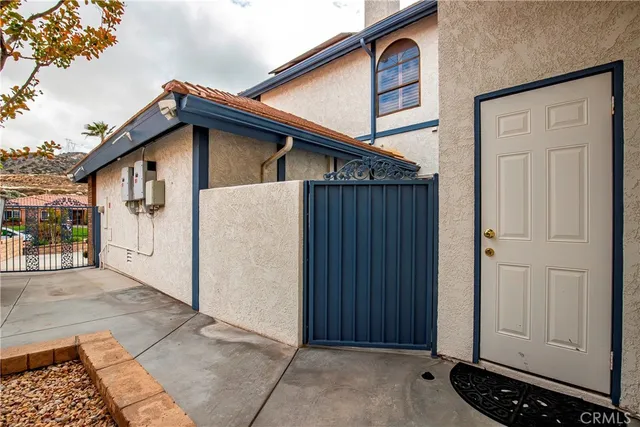 a view of a dining table and chairs in the patio