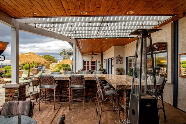a kitchen with stainless steel appliances a stove a sink and a microwave