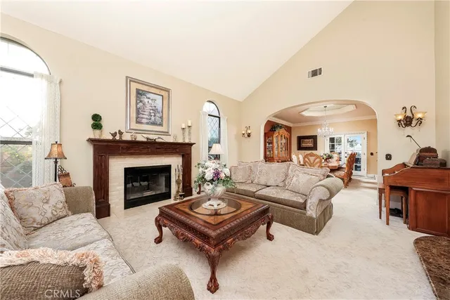 a kitchen with stainless steel appliances granite countertop table chairs sink and cabinets