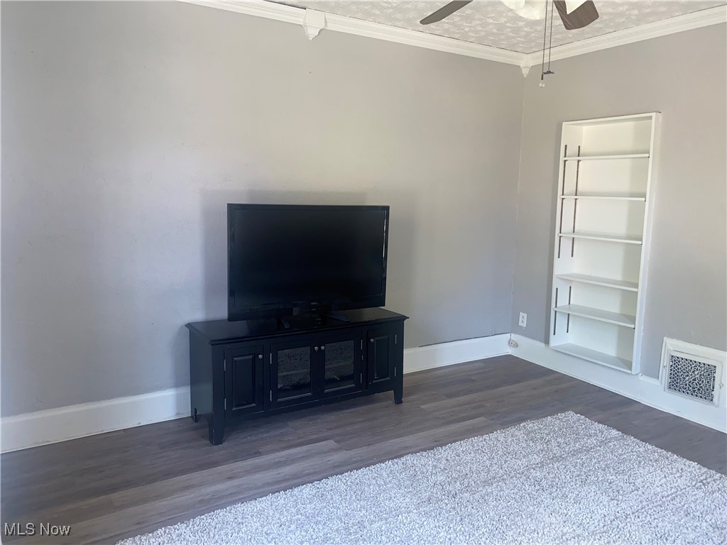 3016 Wadsworth Road Norton, OH 44203 - Photo 17 of 50 Living room with built-ins, ceiling fan and LVP flooring