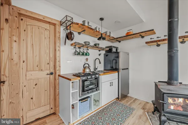 a view of a kitchen with appliances and cabinets