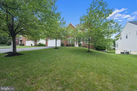 a view of backyard with swimming pool and outdoor seating