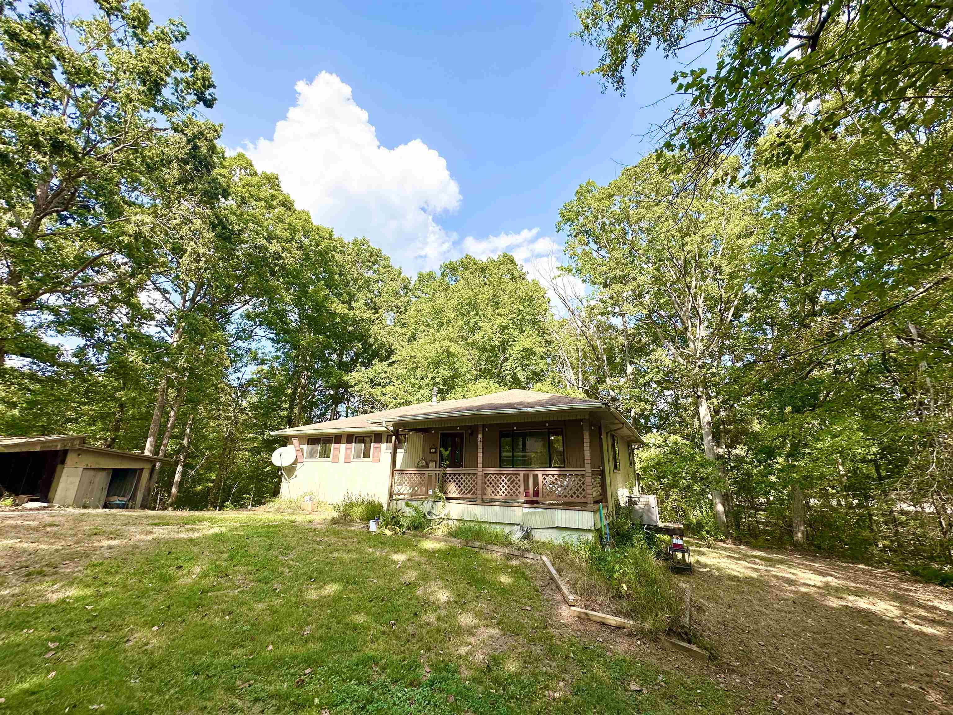 53 Crabtree Road Selmer, TN 38375 - Photo 2 of 28 View of front of property featuring a porch and a front yard