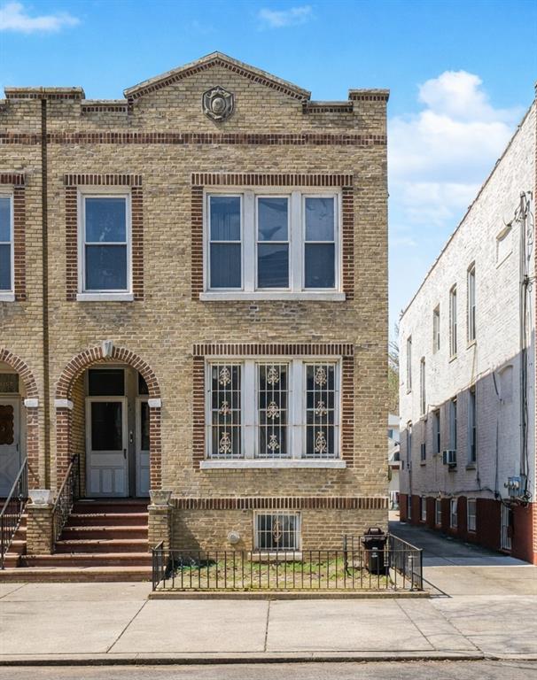 2280 East 22nd Street Brooklyn, NY 11229 - Photo 2 of 5 a front view of a building with a road