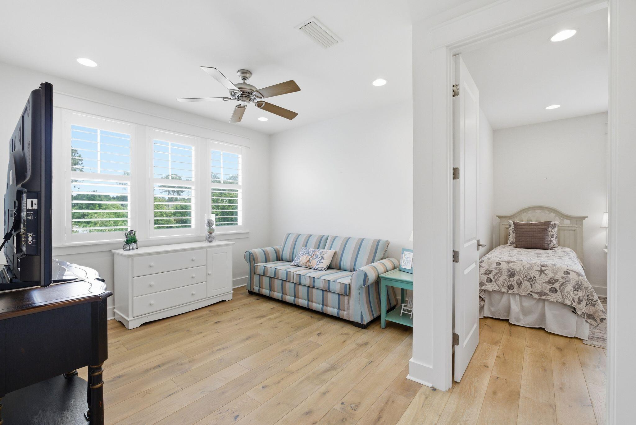 133 Sandchase Circle, Unit LOT 15 Inlet Beach, FL 32461 - Photo 24 of 47 a living room with furniture and a large window