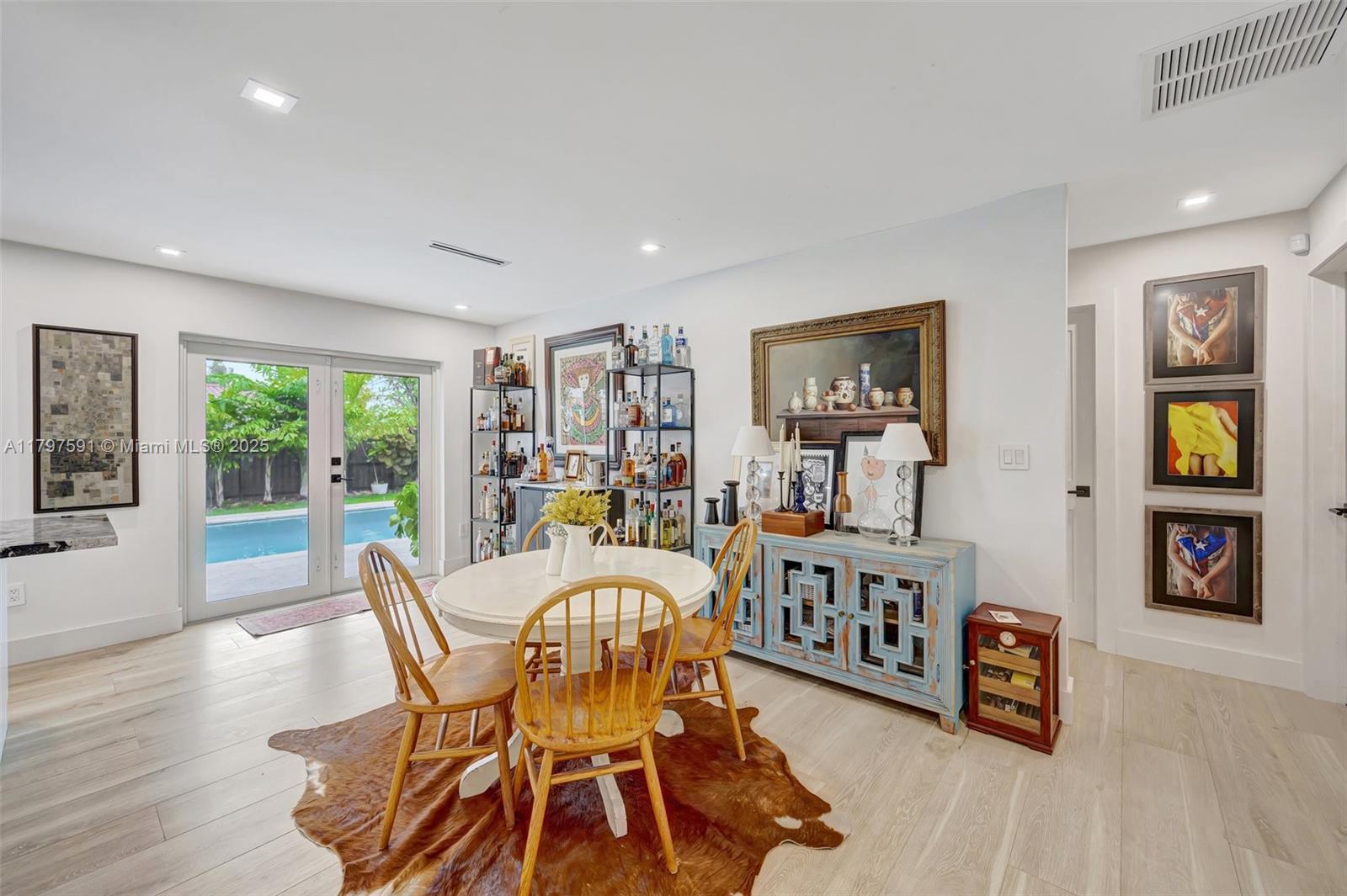 9547 Southwest 59th Terrace Miami, FL 33173 - Photo 12 of 51 a view of a dining room with furniture window and wooden floor