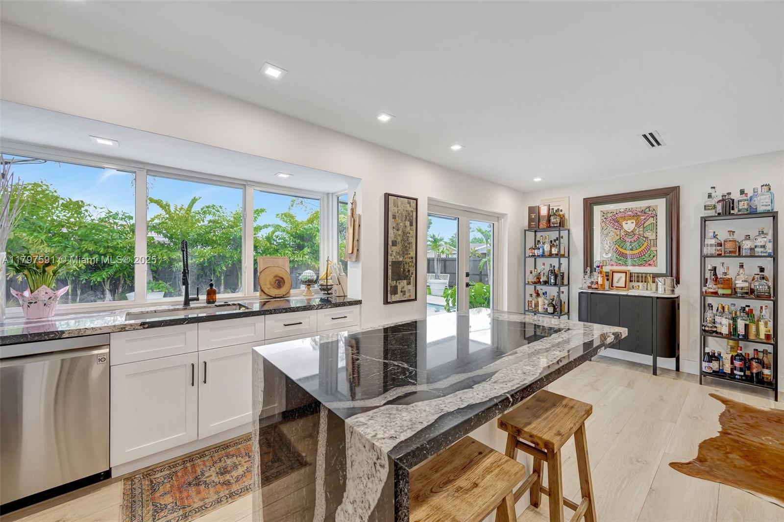 9547 Southwest 59th Terrace Miami, FL 33173 - Photo 16 of 51 a dining hall with stainless steel appliances granite countertop a granite counter tops and a large window