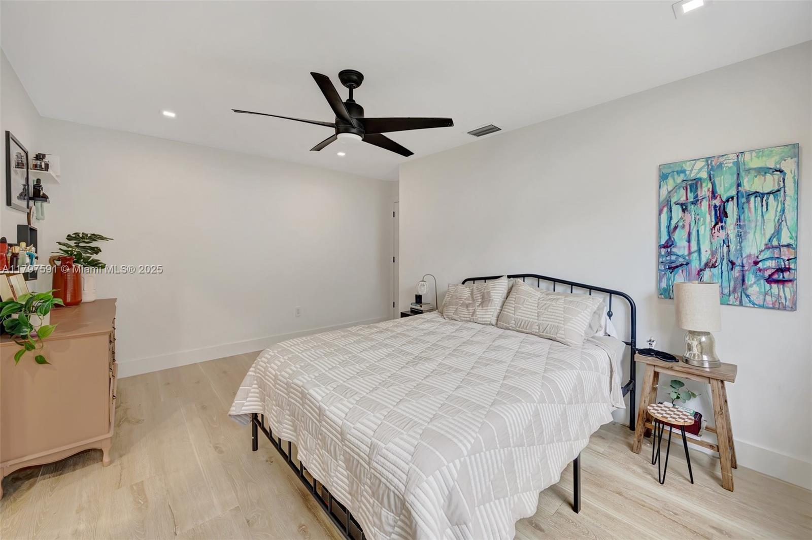 9547 Southwest 59th Terrace Miami, FL 33173 - Photo 19 of 51 a bedroom with a bed and a table in it