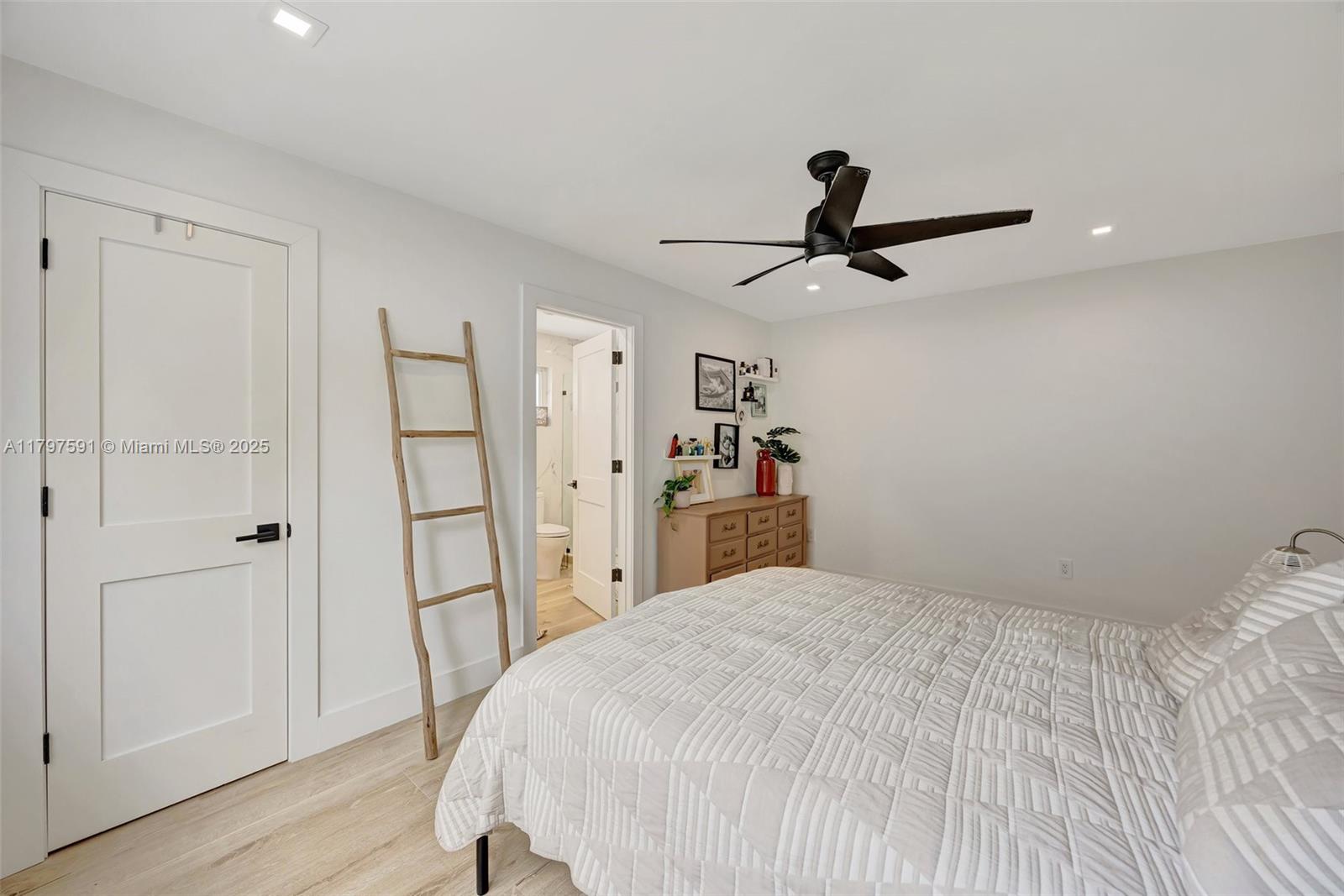 9547 Southwest 59th Terrace Miami, FL 33173 - Photo 20 of 51 a bedroom with a bed and a chandelier