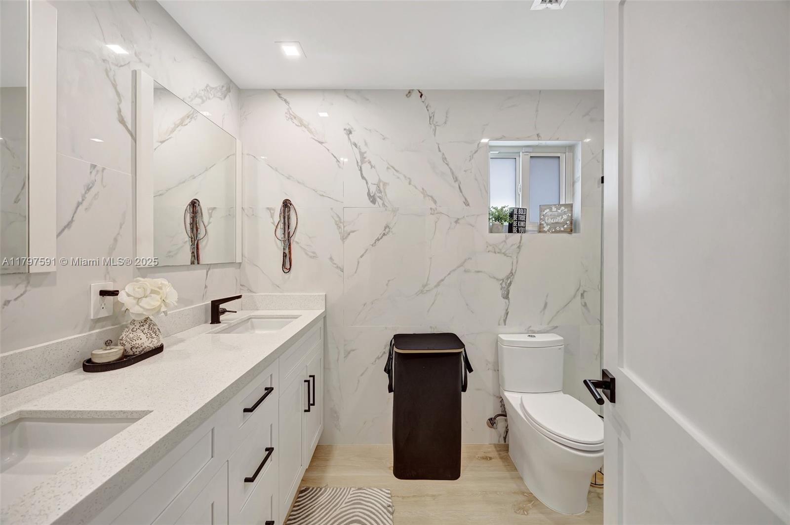 9547 Southwest 59th Terrace Miami, FL 33173 - Photo 21 of 51 a bathroom with a granite countertop sink toilet and shower