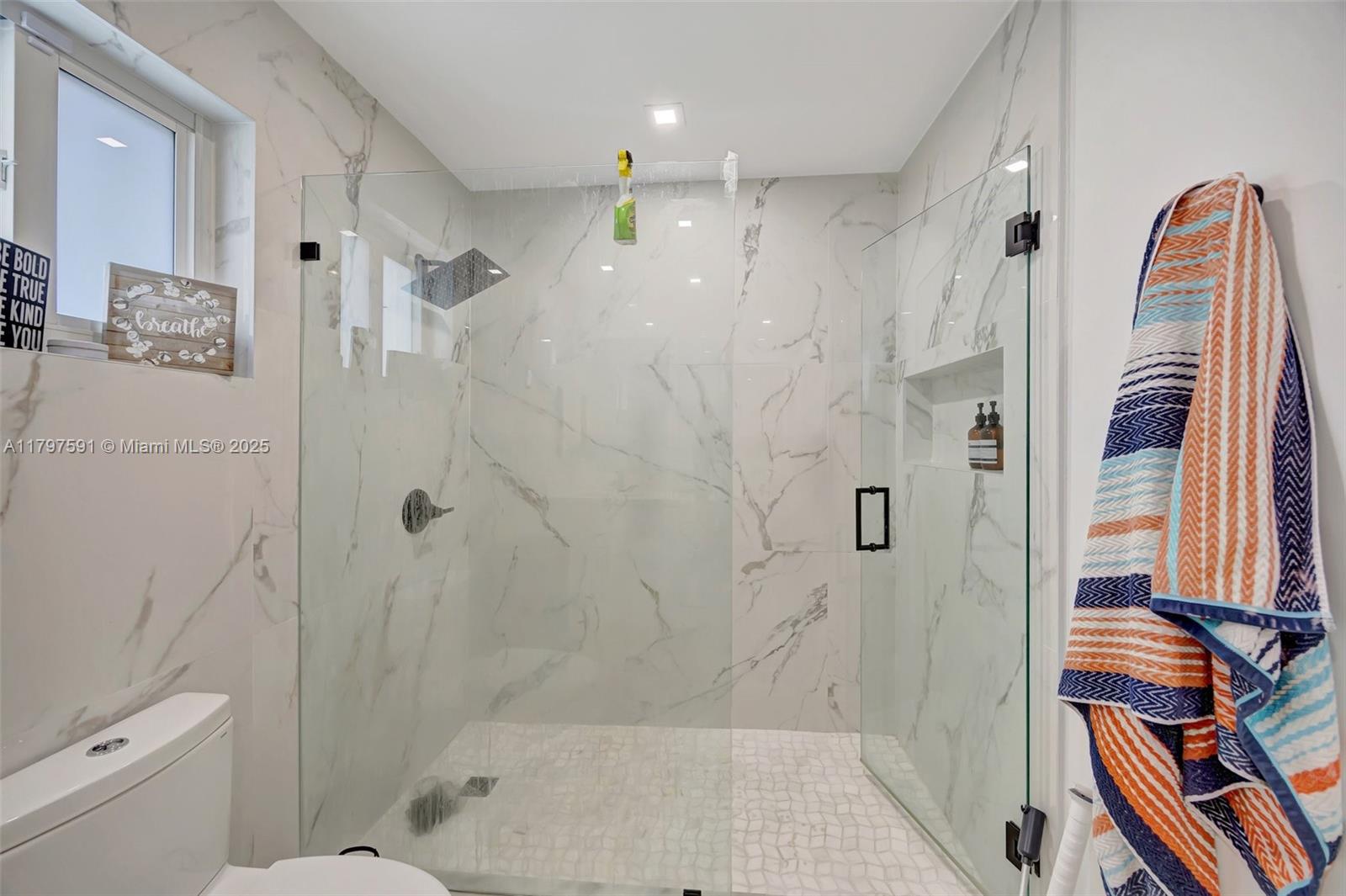 9547 Southwest 59th Terrace Miami, FL 33173 - Photo 23 of 51 a bathroom with a bathtub and a shower