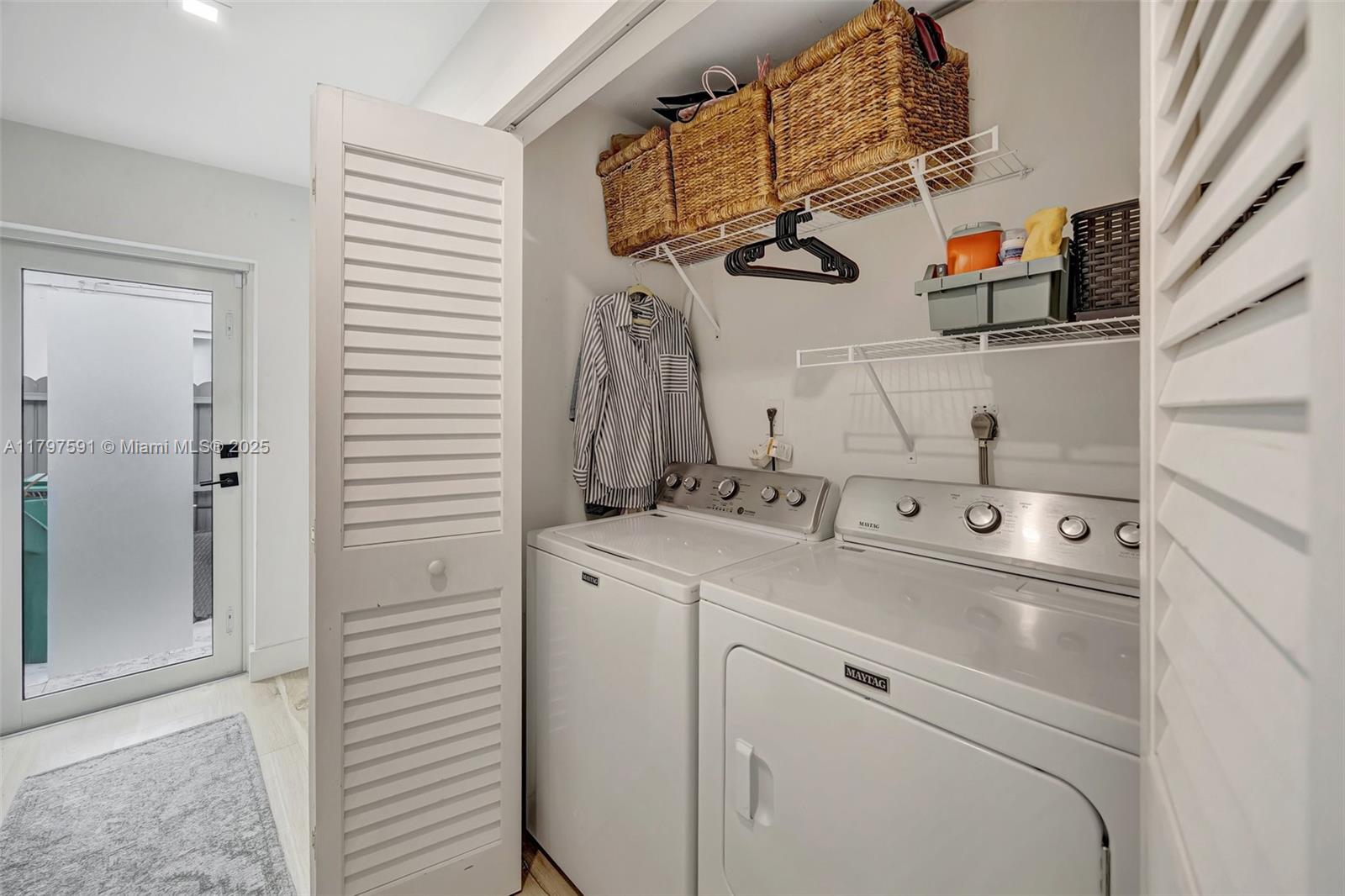9547 Southwest 59th Terrace Miami, FL 33173 - Photo 24 of 51 a utility room with dryer and washer
