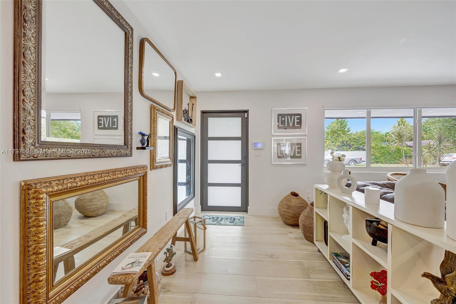 9547 Southwest 59th Terrace Miami, FL 33173 - Photo 3 of 51 a spacious bedroom with a bed and a large window