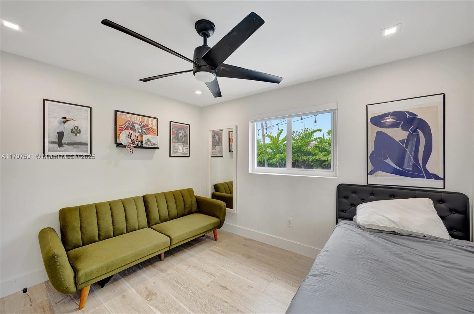 9547 Southwest 59th Terrace Miami, FL 33173 - Photo 34 of 51 a blue and white couch sitting in a room