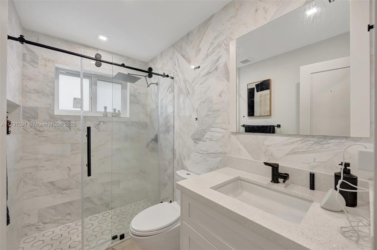 9547 Southwest 59th Terrace Miami, FL 33173 - Photo 35 of 51 a bathroom with a sink toilet and shower