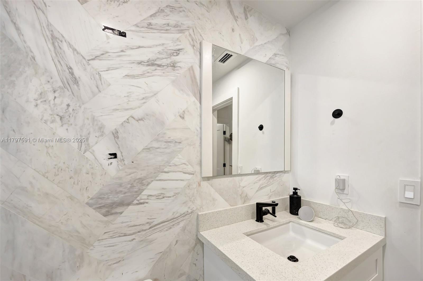 9547 Southwest 59th Terrace Miami, FL 33173 - Photo 36 of 51 a bathroom with a sink and a mirror