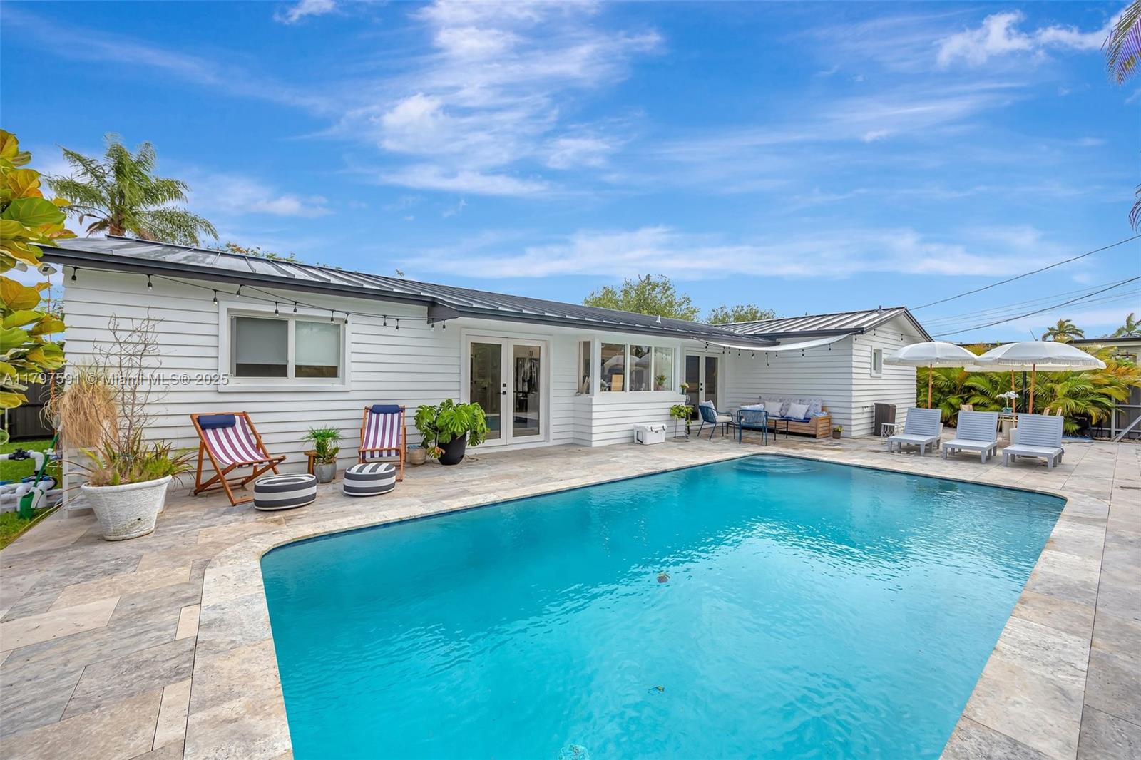 9547 Southwest 59th Terrace Miami, FL 33173 - Photo 39 of 51 a view of a house with pool and chairs