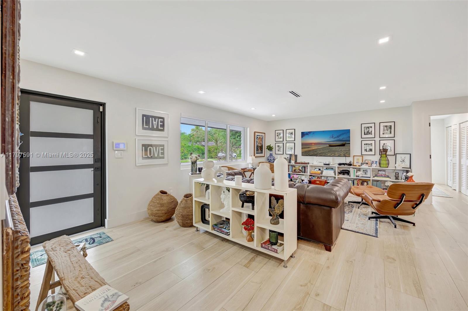 9547 Southwest 59th Terrace Miami, FL 33173 - Photo 4 of 51 a living room with furniture and a flat screen tv