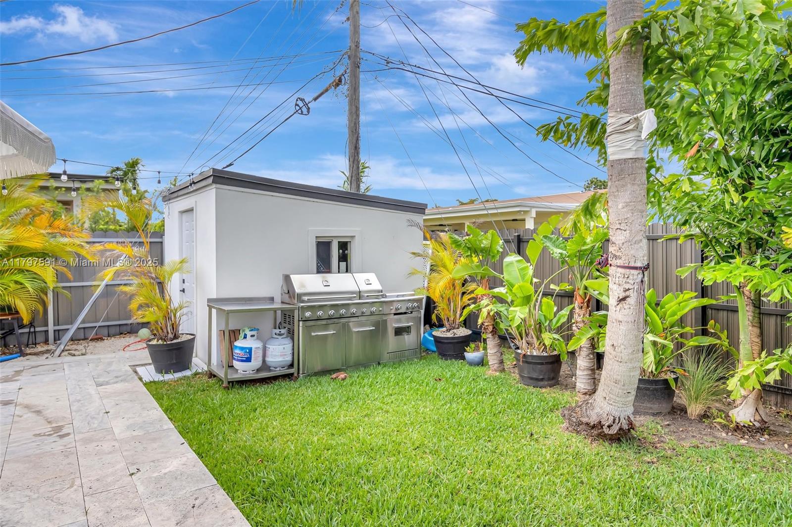 9547 Southwest 59th Terrace Miami, FL 33173 - Photo 45 of 51 a front view of a house with garden