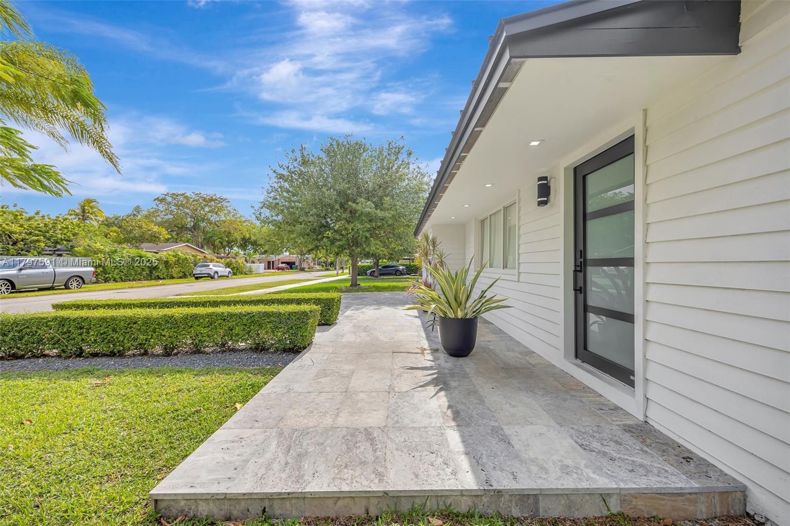 9547 Southwest 59th Terrace Miami, FL 33173 - Photo 48 of 51 a view of a porch with a garden