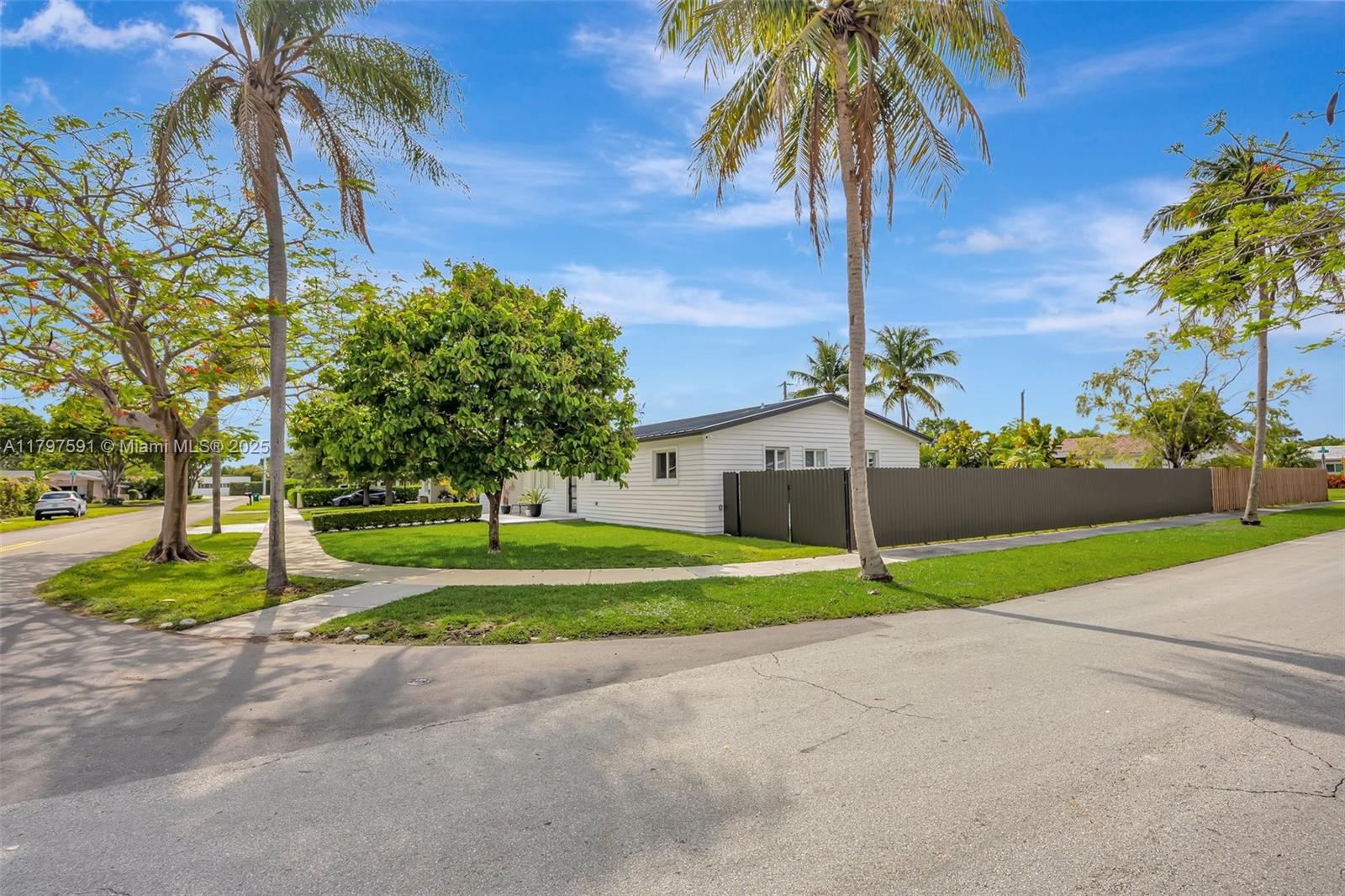 9547 Southwest 59th Terrace Miami, FL 33173 - Photo 51 of 51 a house with palm tree in front of it