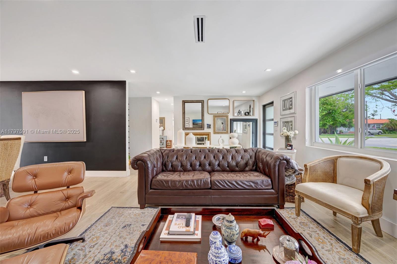 9547 Southwest 59th Terrace Miami, FL 33173 - Photo 6 of 51 a living room with furniture and a large window