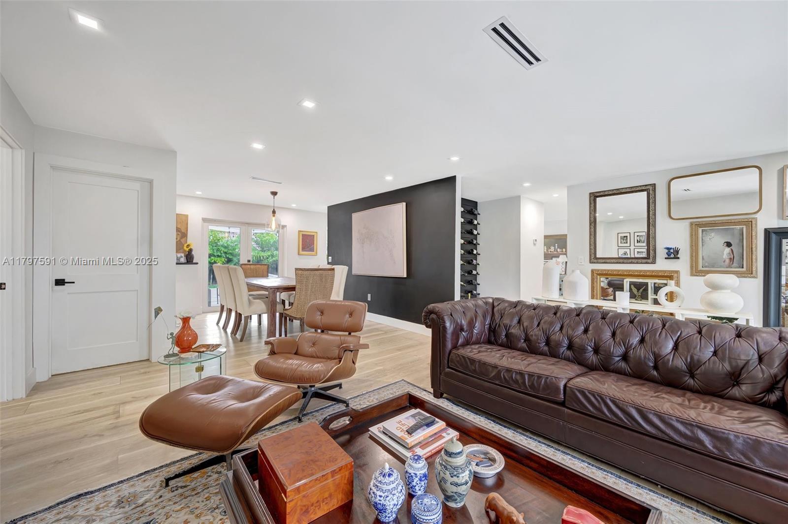 9547 Southwest 59th Terrace Miami, FL 33173 - Photo 7 of 51 a living room with furniture and a large window
