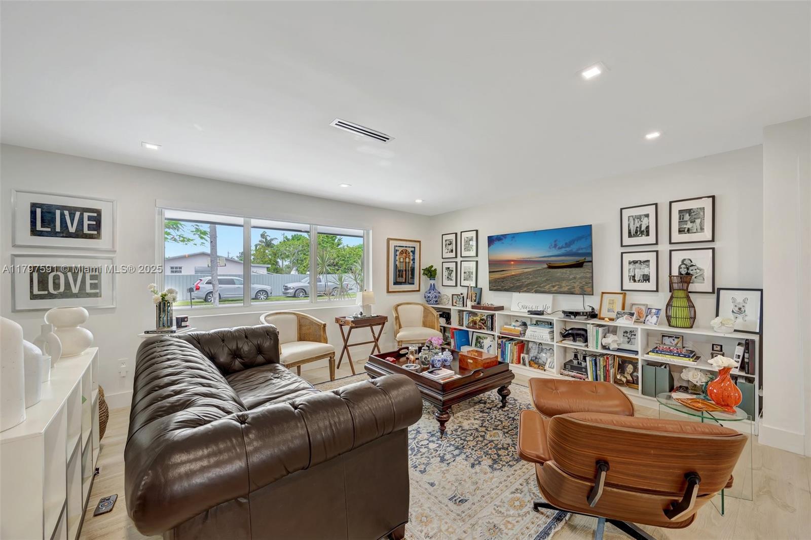 9547 Southwest 59th Terrace Miami, FL 33173 - Photo 8 of 51 a living room with furniture and a flat screen tv