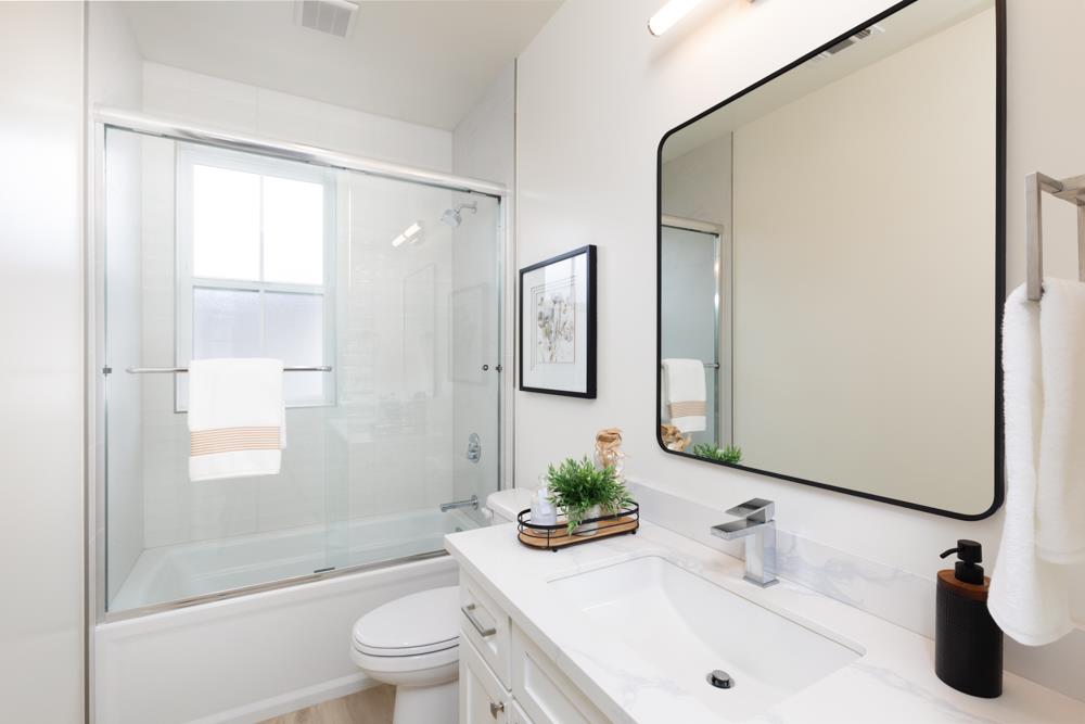 103 Staggi Lane Soquel, CA 95073 - Photo 25 of 35 a bathroom with a sink a toilet and shower