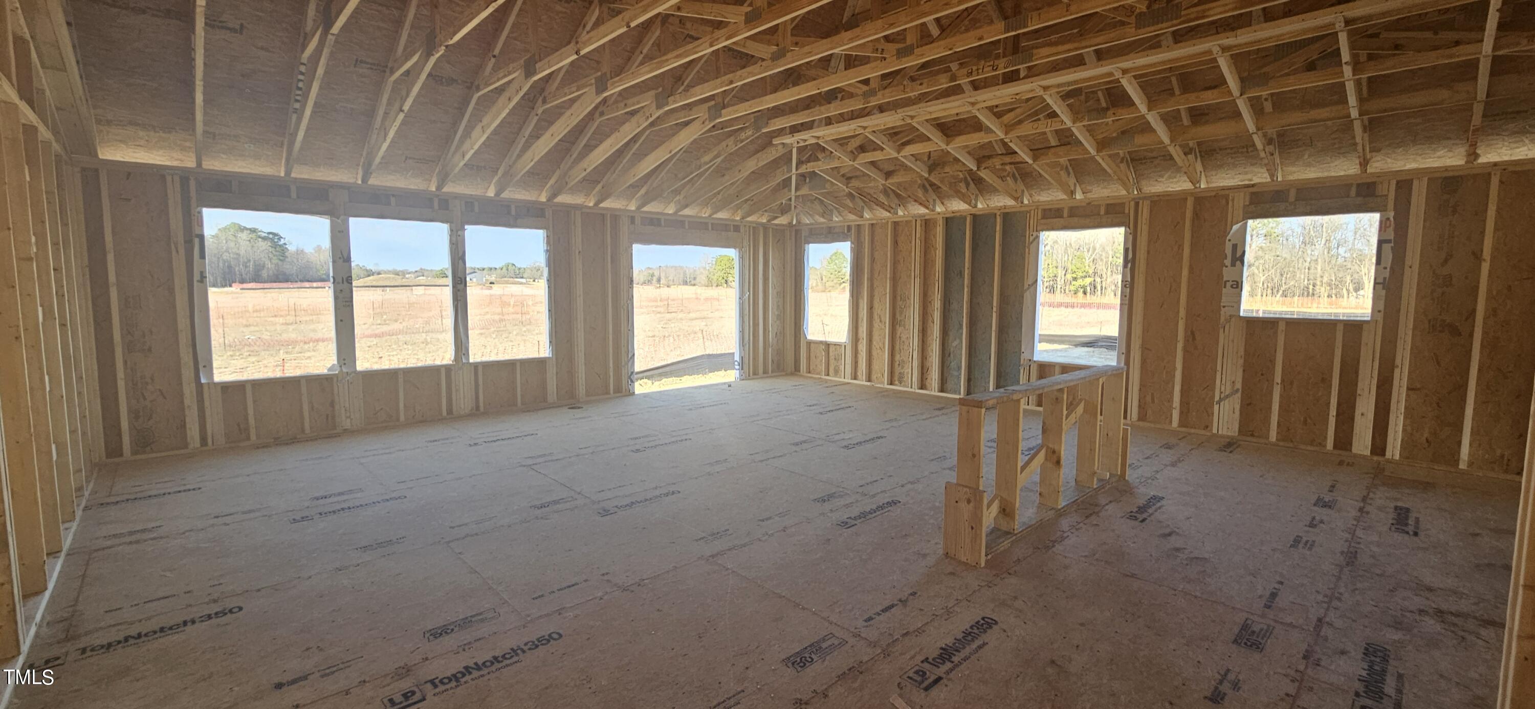 7652 Redwood Rdg Way Willow Spring, NC 27592 - Photo 3 of 12 a view of an empty room with a window
