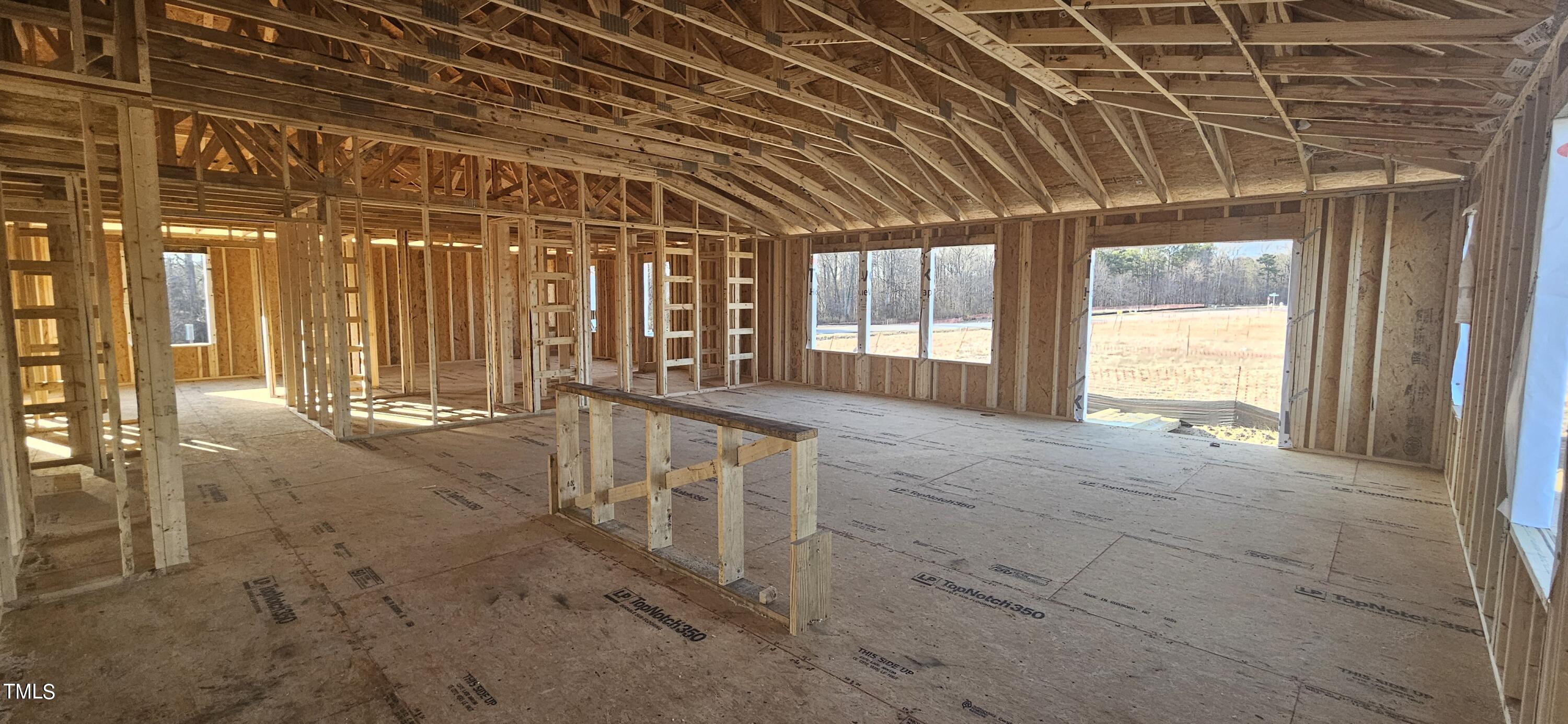 7652 Redwood Rdg Way Willow Spring, NC 27592 - Photo 4 of 12 a view of an empty room with windows