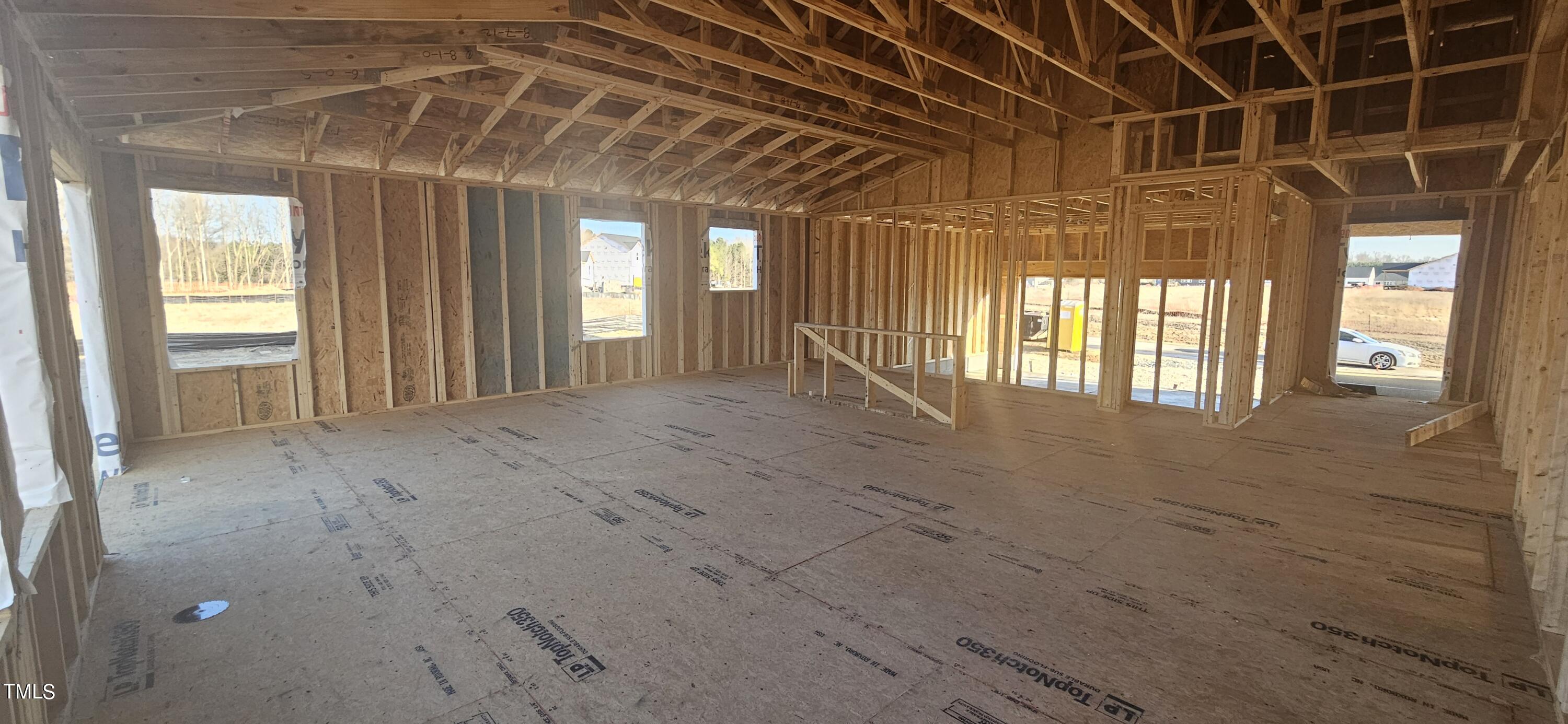 7652 Redwood Rdg Way Willow Spring, NC 27592 - Photo 6 of 12 a view of an empty room with a window