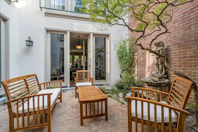 a view of two chairs in the balcony