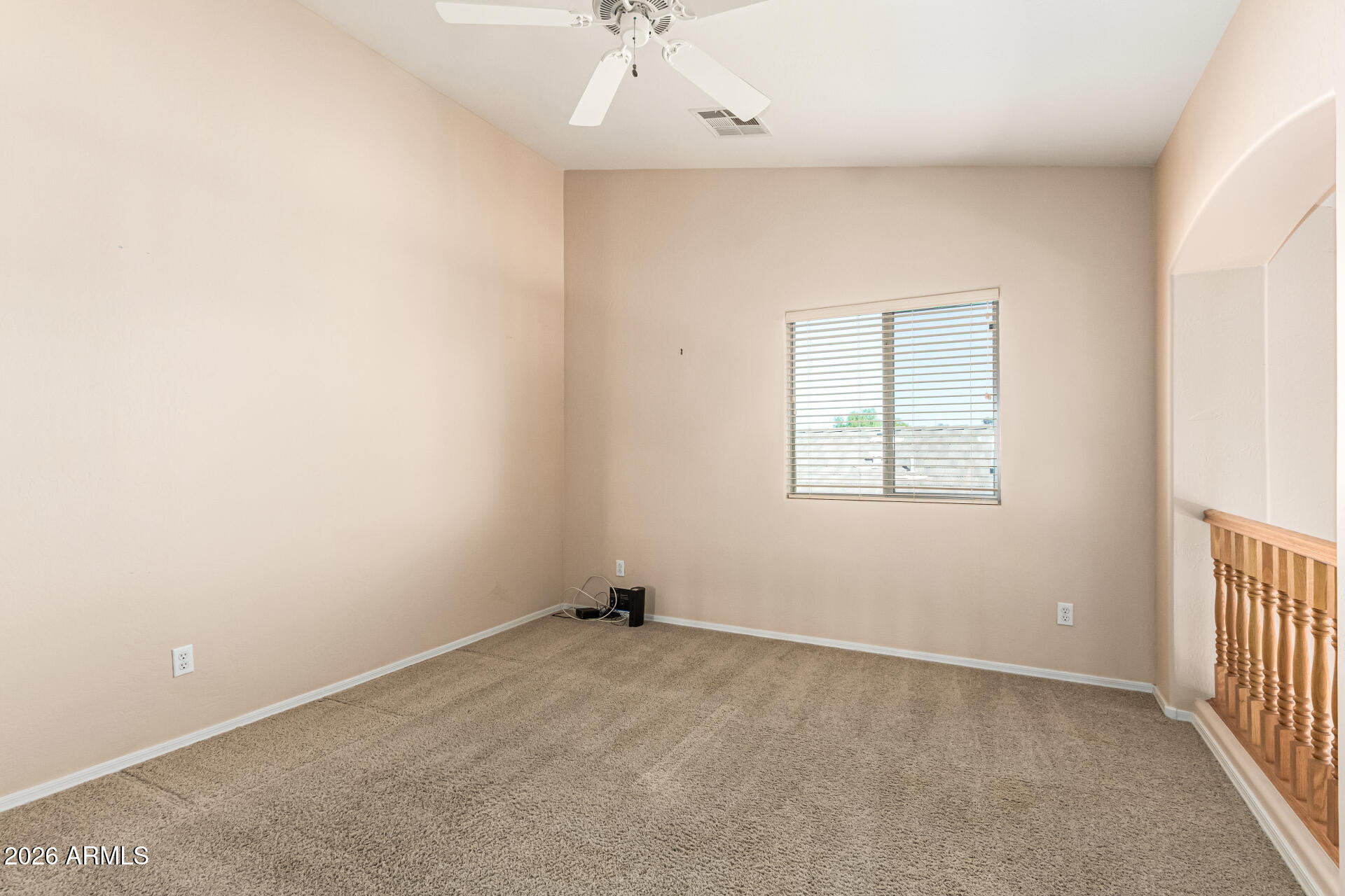 25660 West Dunlap Road Buckeye, AZ 85326 - Photo 16 of 40 an empty room with a window