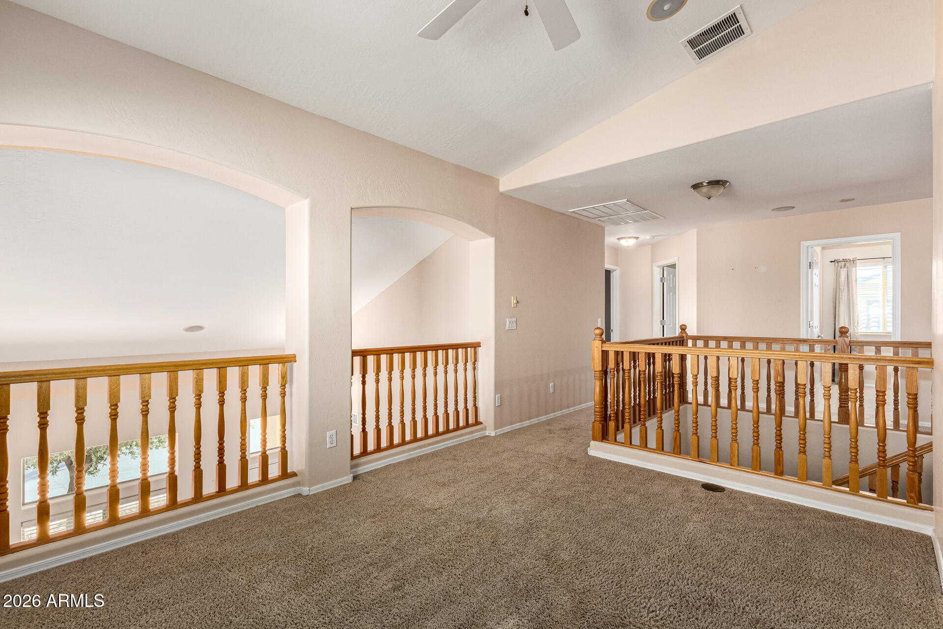 25660 West Dunlap Road Buckeye, AZ 85326 - Photo 17 of 40 a view of a hallway with a livingroom