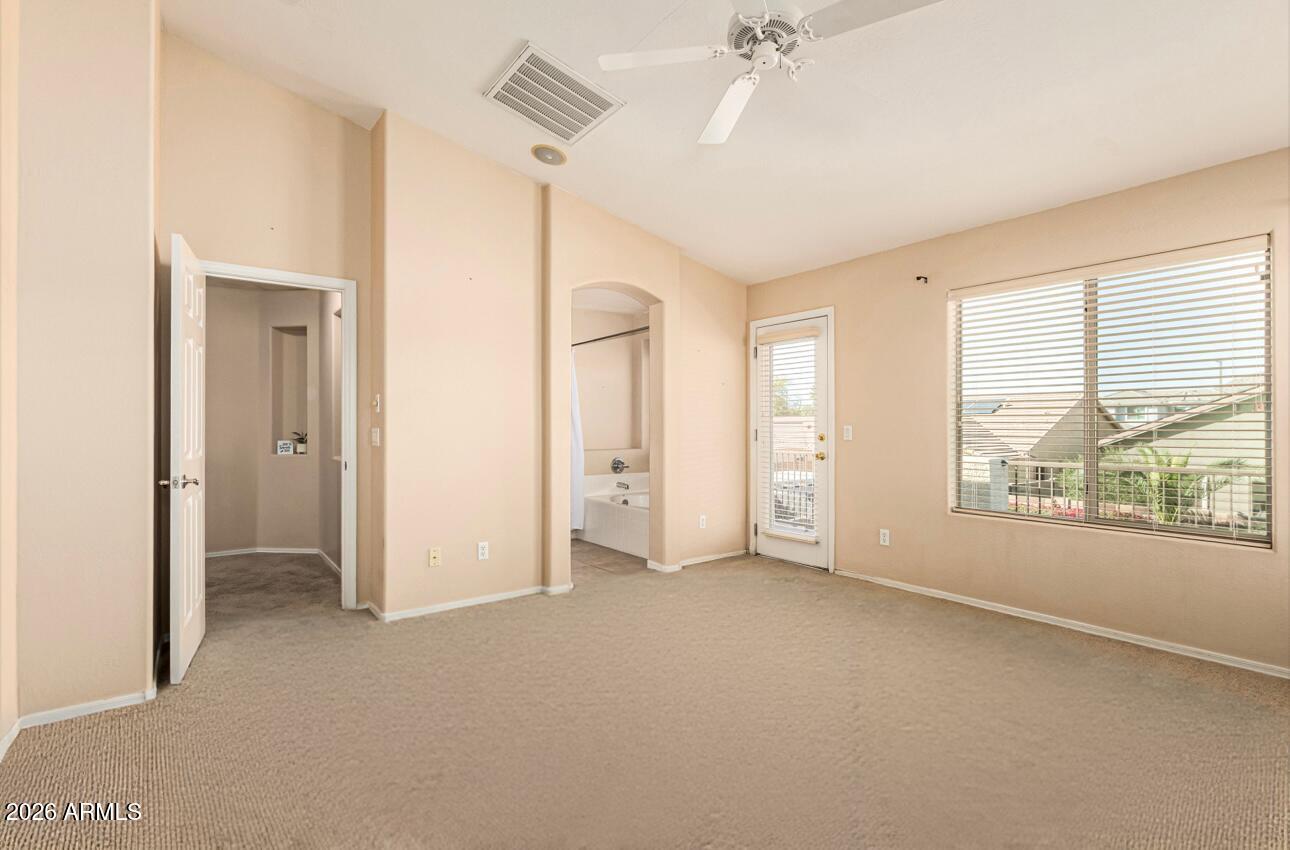 25660 West Dunlap Road Buckeye, AZ 85326 - Photo 19 of 40 a view of an empty room with a window