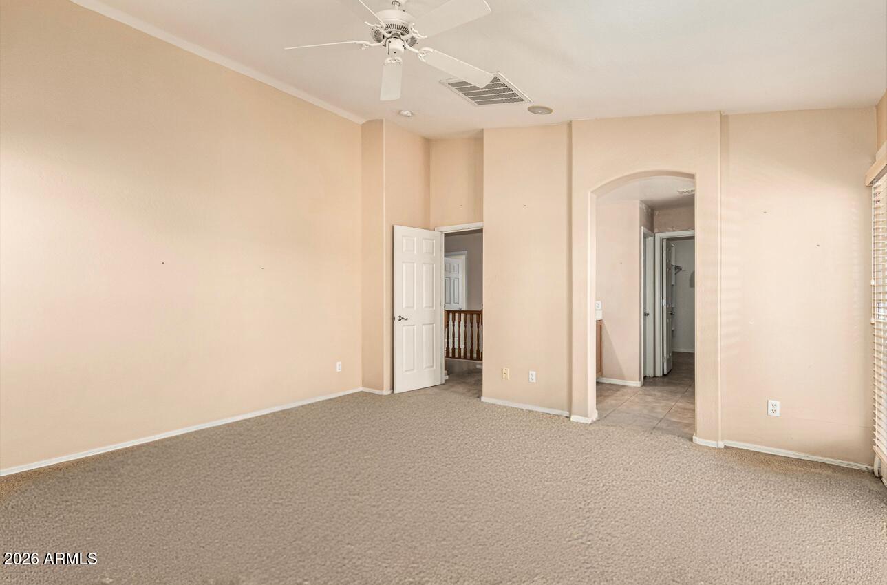 25660 West Dunlap Road Buckeye, AZ 85326 - Photo 20 of 40 a view of empty room with ceiling fan