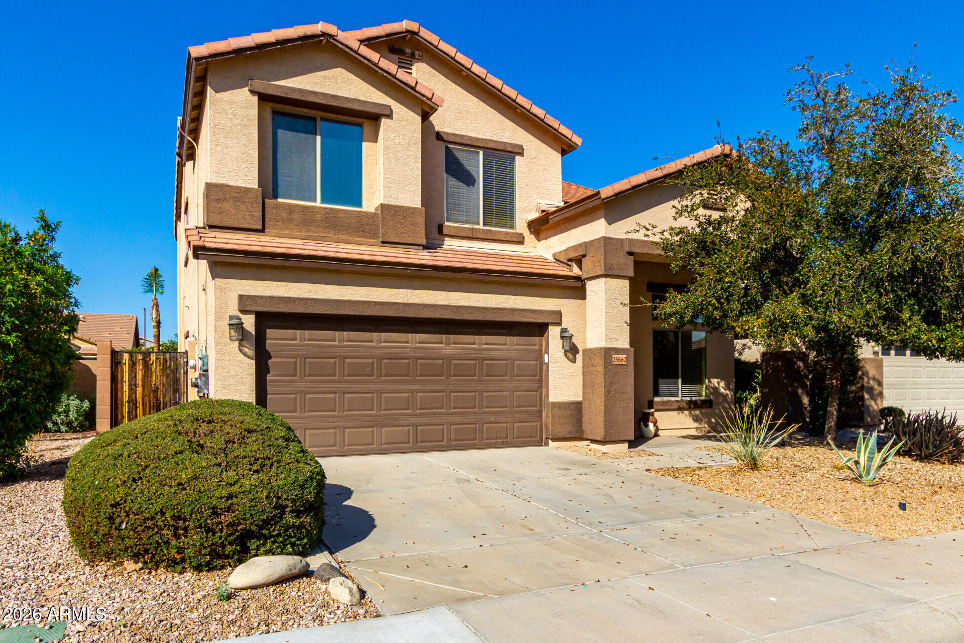 25660 West Dunlap Road Buckeye, AZ 85326 - Photo 2 of 40 a front view of a house with a yard