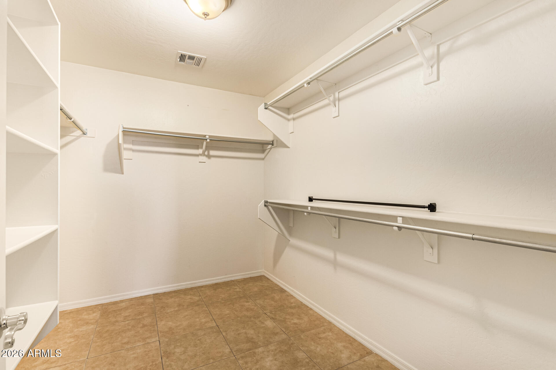 25660 West Dunlap Road Buckeye, AZ 85326 - Photo 24 of 40 a view of an empty walk in closet