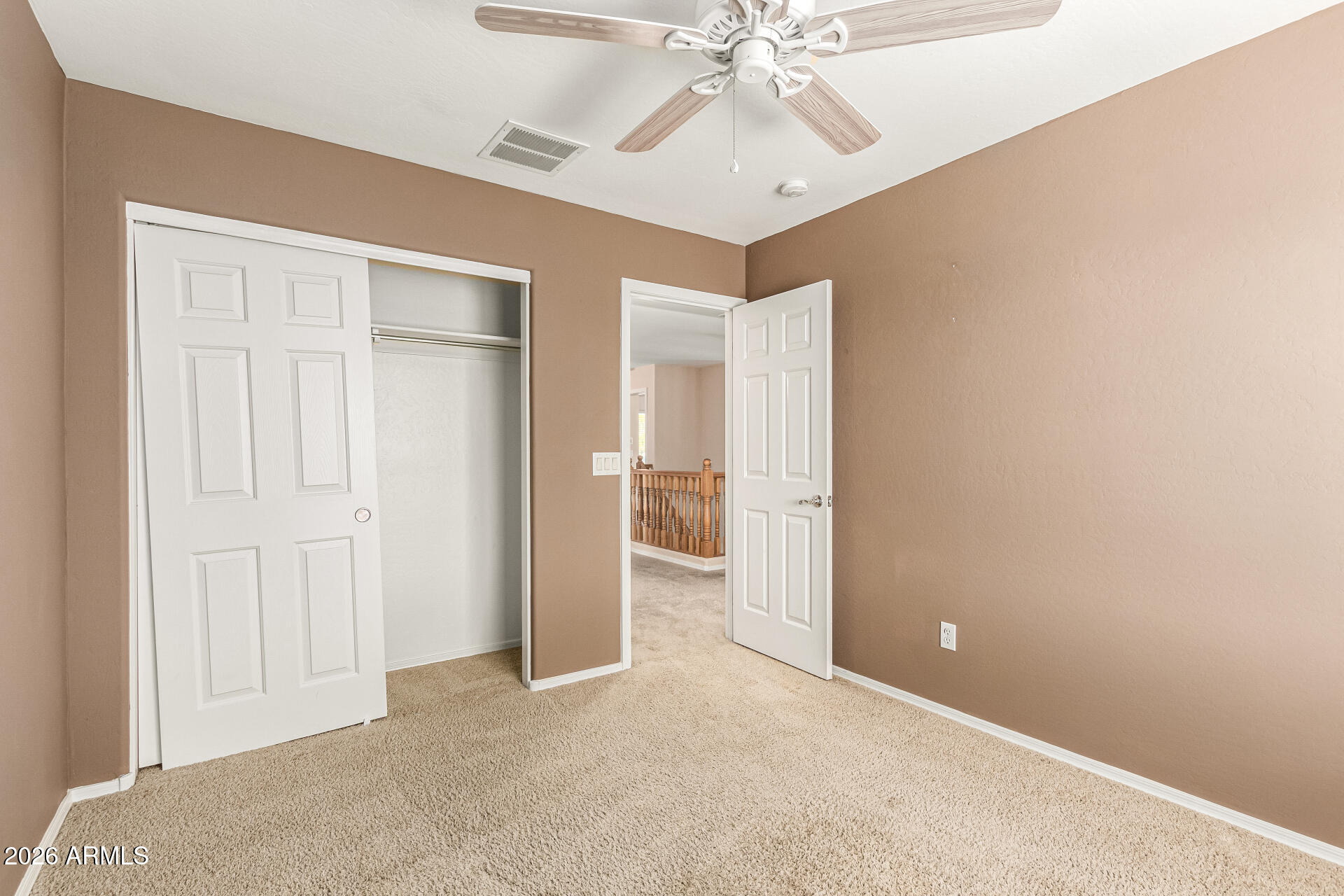 25660 West Dunlap Road Buckeye, AZ 85326 - Photo 28 of 40 an empty room with a view of a hallway