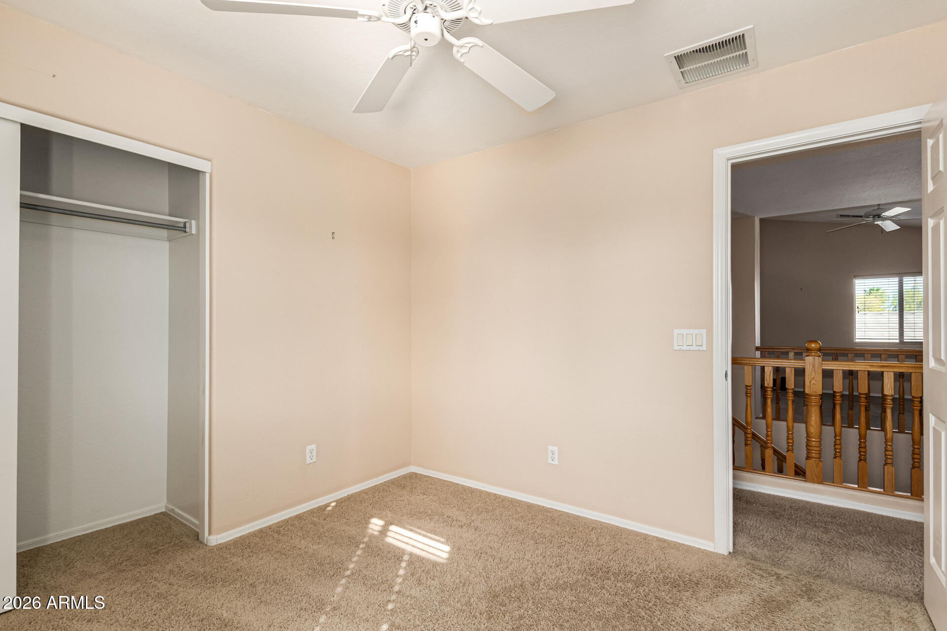 25660 West Dunlap Road Buckeye, AZ 85326 - Photo 30 of 40 an empty room with windows & fan