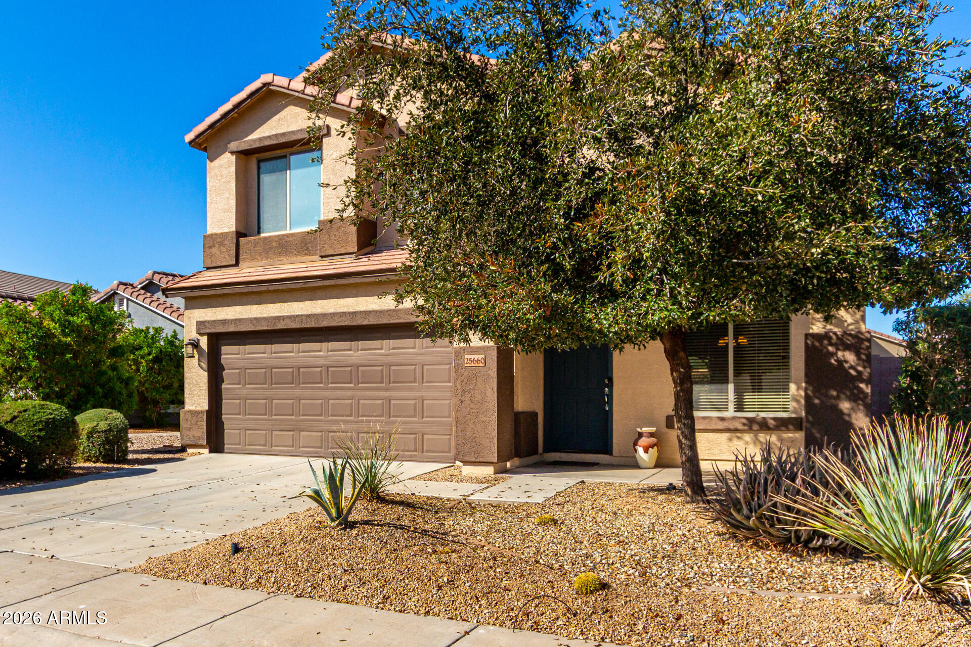 25660 West Dunlap Road Buckeye, AZ 85326 - Photo 3 of 40 a house with trees in front of it
