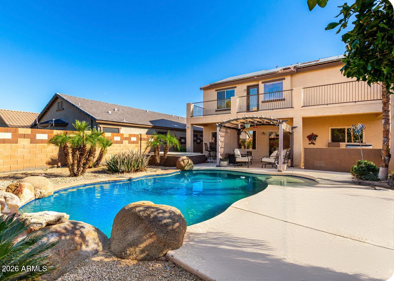 25660 West Dunlap Road Buckeye, AZ 85326 - Photo 39 of 40 a view of a house with swimming pool and a porch