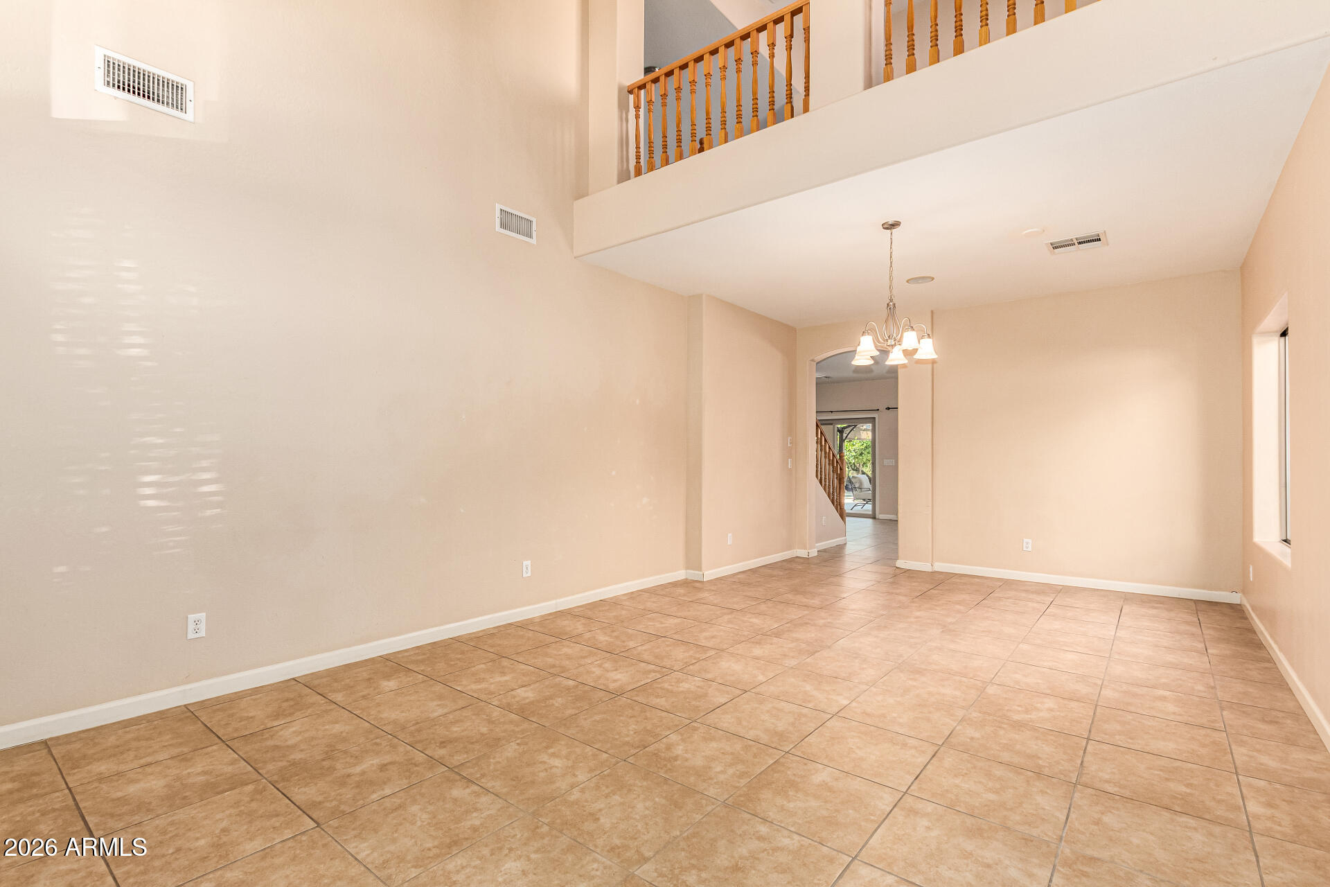 25660 West Dunlap Road Buckeye, AZ 85326 - Photo 5 of 40 a view of an empty room with a kitchen