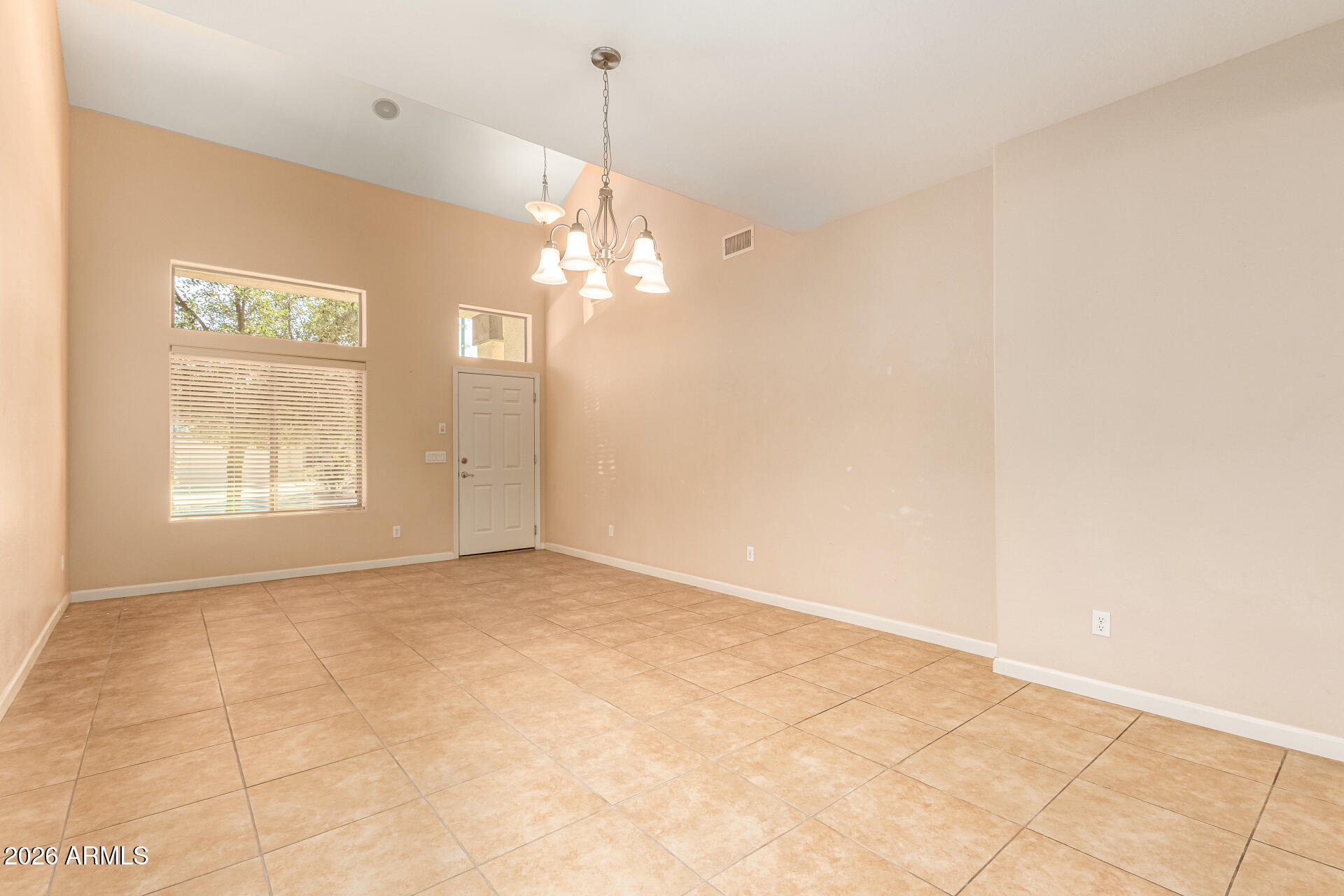 25660 West Dunlap Road Buckeye, AZ 85326 - Photo 6 of 40 a view of an empty room with a window