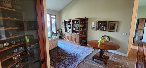a room with furniture and a book shelf