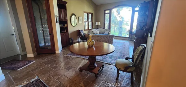 a living room with furniture and a sink