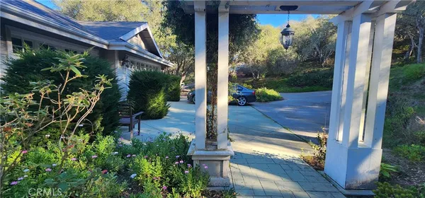 a view of a porch with a door front of house